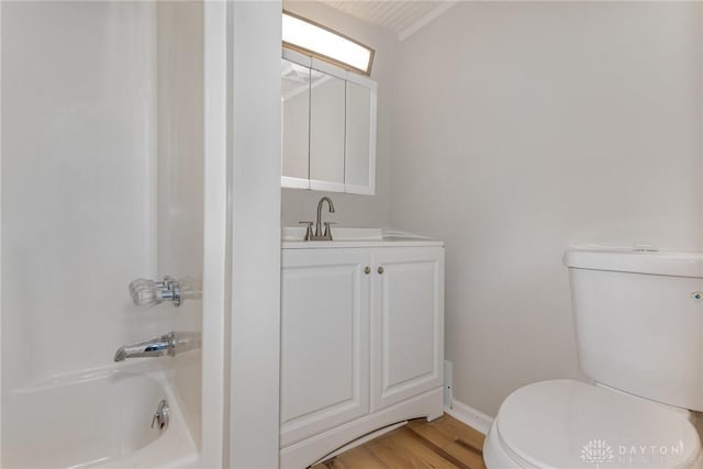 full bathroom featuring vanity, hardwood / wood-style floors,  shower combination, and toilet