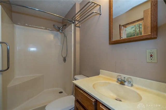 full bath with toilet, walk in shower, a textured ceiling, and vanity