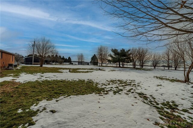 view of yard layered in snow