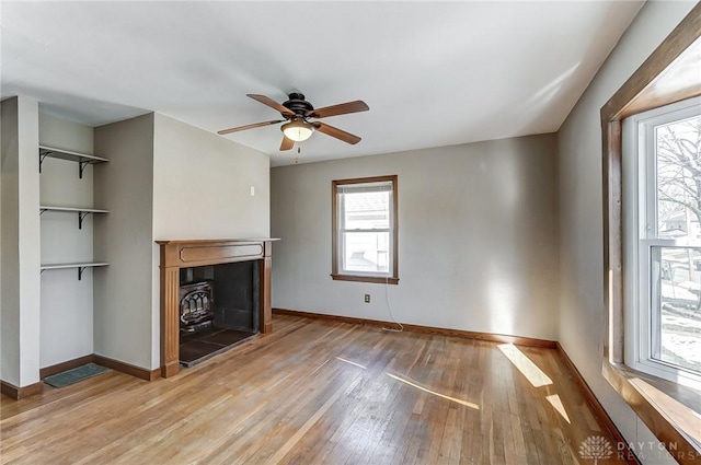 unfurnished living room with hardwood / wood-style floors and ceiling fan