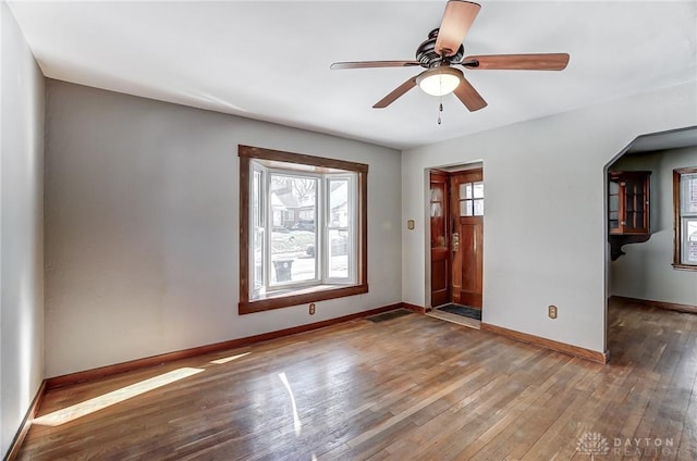 interior space featuring wood-type flooring and ceiling fan