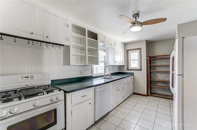 kitchen with light tile patterned flooring, sink, ceiling fan, white appliances, and white cabinets