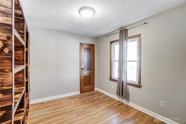 unfurnished room featuring light wood-type flooring