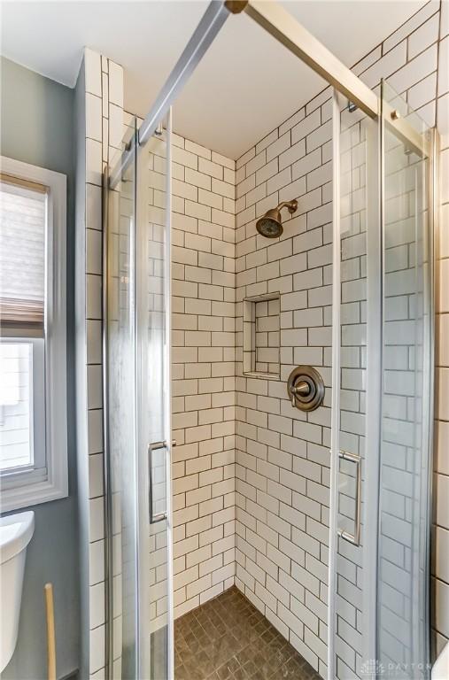 bathroom with an enclosed shower