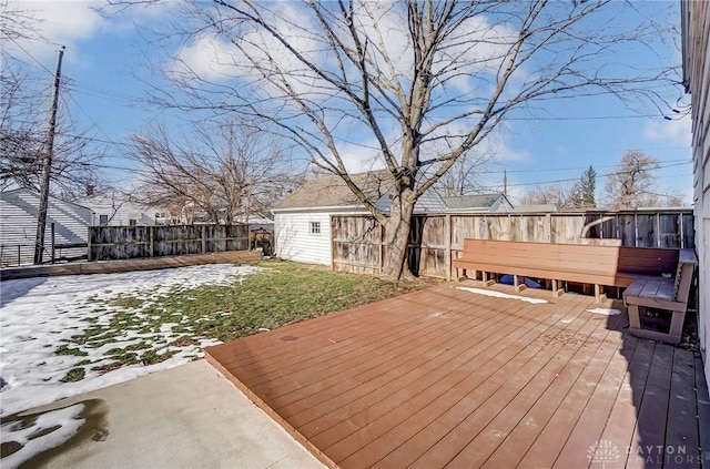 wooden deck featuring a lawn