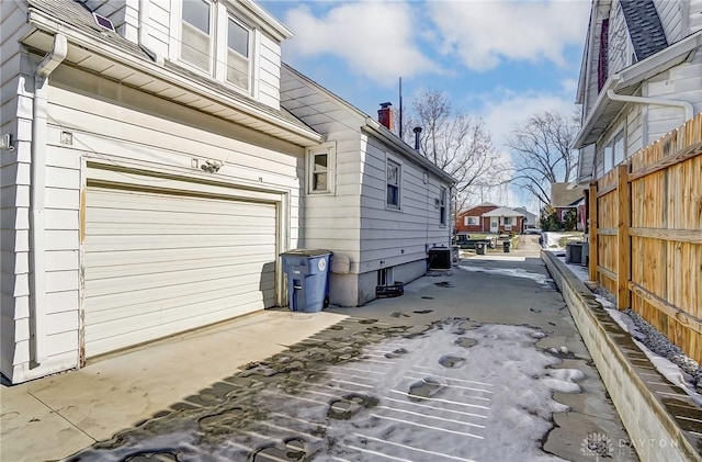 view of side of property with a garage