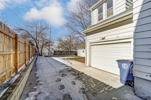 view of property exterior featuring a garage