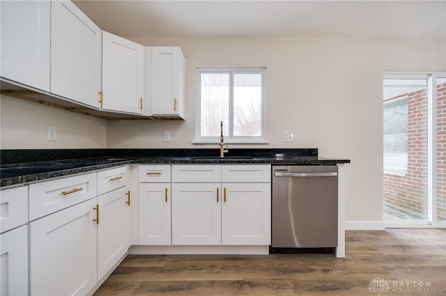 kitchen with a sink, dark wood-style floors, white cabinetry, and stainless steel dishwasher