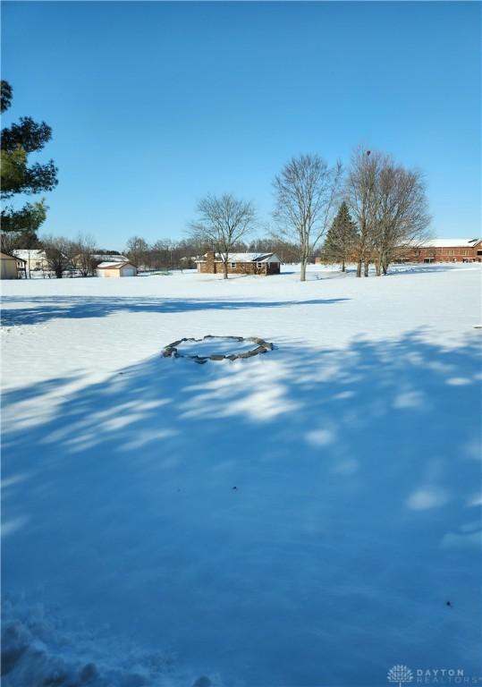 view of yard layered in snow