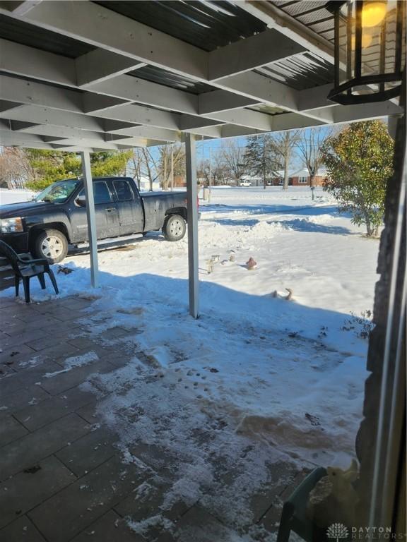 view of snow covered patio