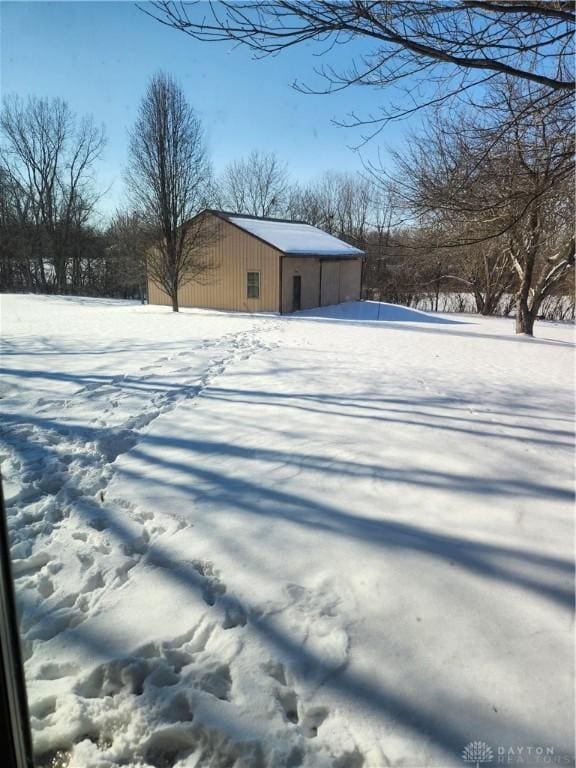 view of yard covered in snow