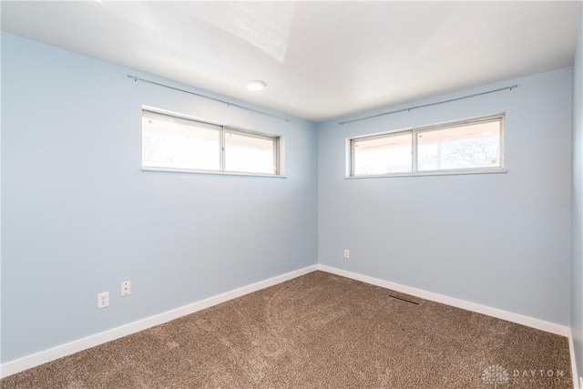 unfurnished room with carpet floors