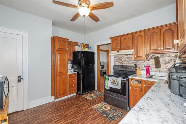 kitchen with dark wood-type flooring, black fridge, tasteful backsplash, electric range, and ceiling fan