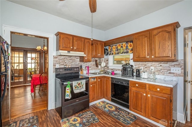 kitchen featuring dark wood-type flooring, sink, dishwasher, stainless steel electric stove, and decorative backsplash