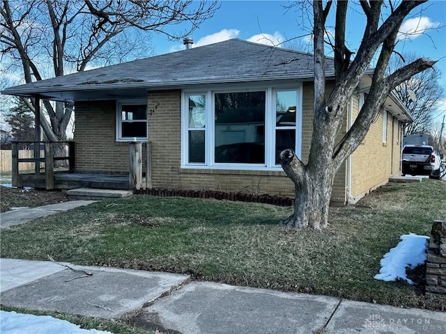 bungalow with a front yard