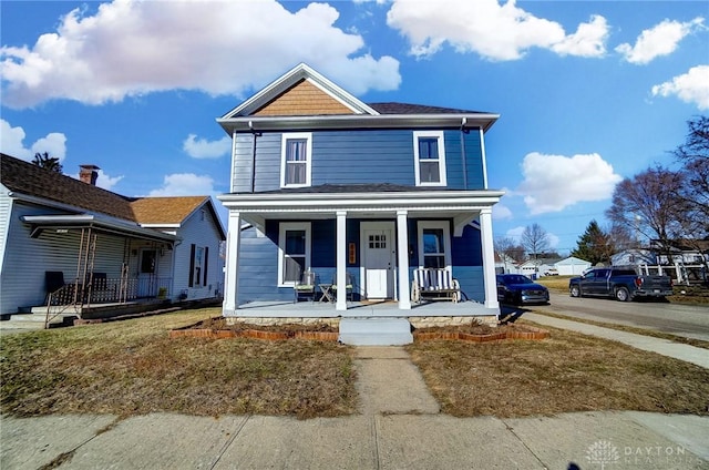 view of front of property featuring covered porch