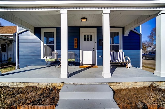 entrance to property featuring covered porch