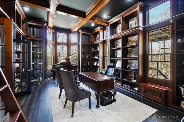 office space with built in shelves, coffered ceiling, ornamental molding, beam ceiling, and hardwood / wood-style floors