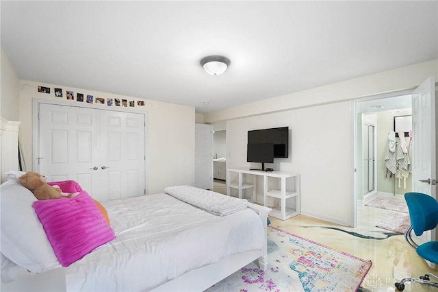 bedroom with a closet and wood finished floors