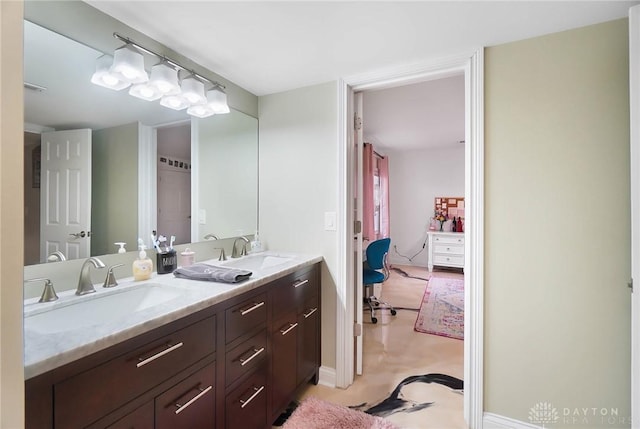 bathroom with double vanity and a sink