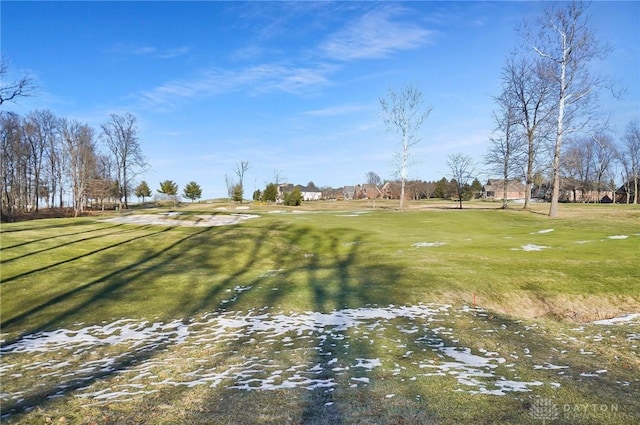 surrounding community featuring a lawn