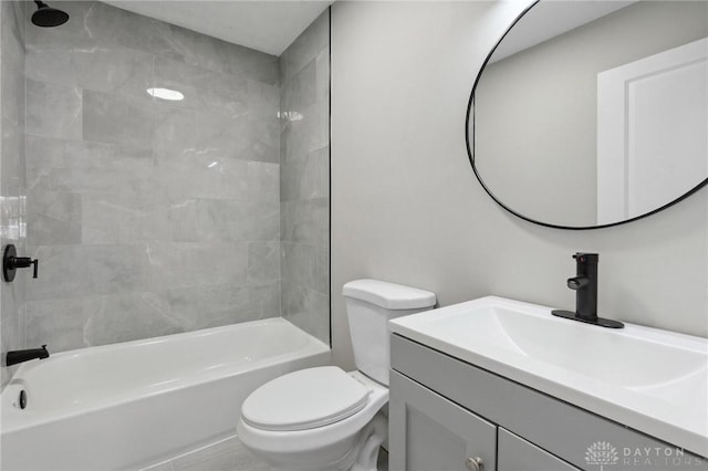 full bathroom with vanity, toilet, and tiled shower / bath combo