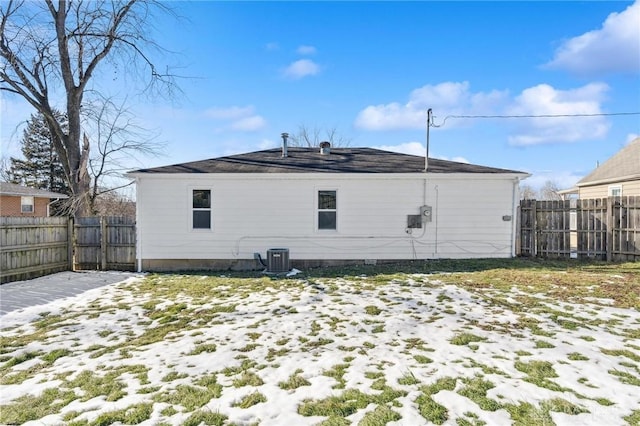 snow covered property featuring cooling unit