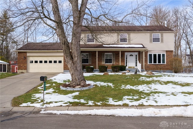 view of front facade featuring a garage and a yard