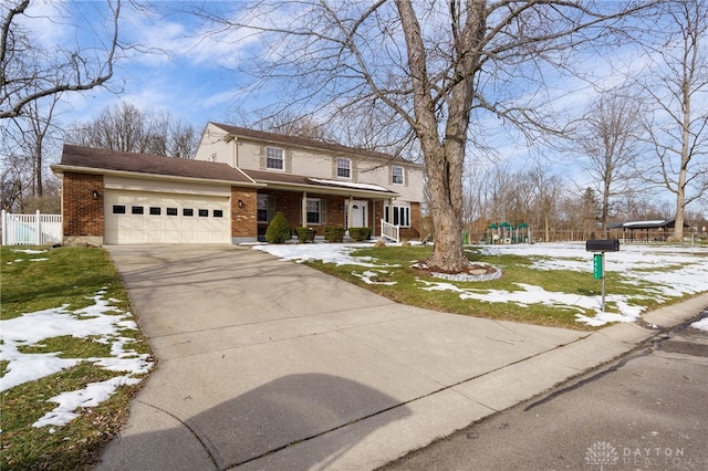 front facade with a garage and a lawn