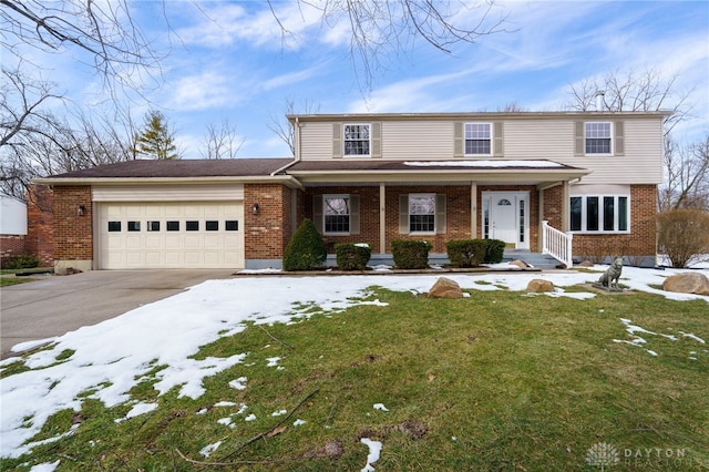 view of front property featuring a garage, a porch, and a lawn