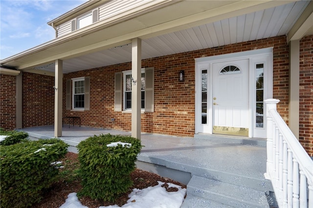 doorway to property featuring covered porch