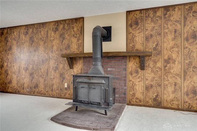 details with carpet, a wood stove, and a textured ceiling