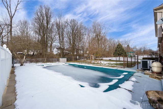 snow covered pool with central AC