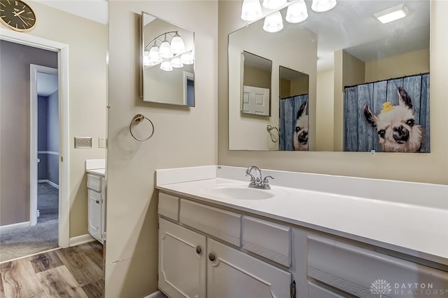 bathroom with vanity and wood-type flooring