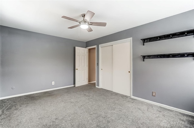 unfurnished bedroom featuring ceiling fan and carpet flooring