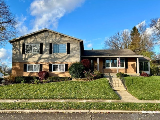 split level home with a front yard