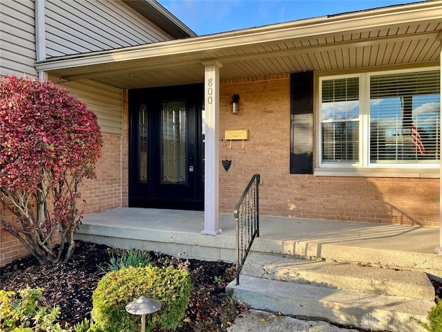 property entrance featuring covered porch