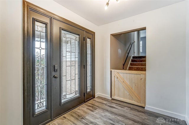 foyer entrance featuring hardwood / wood-style flooring