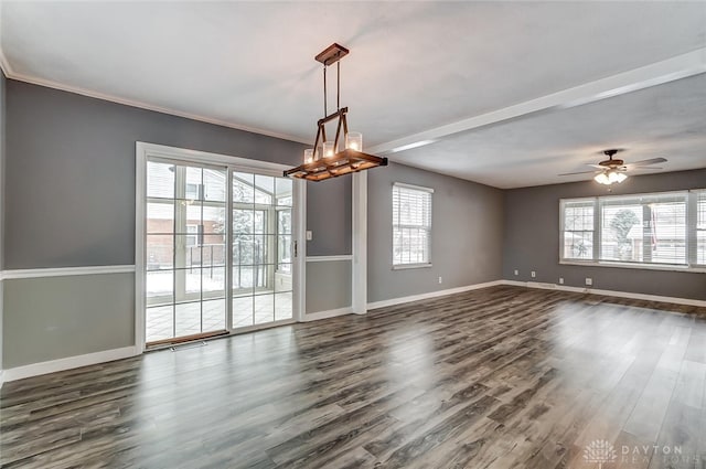 interior space with crown molding, dark wood-type flooring, and ceiling fan