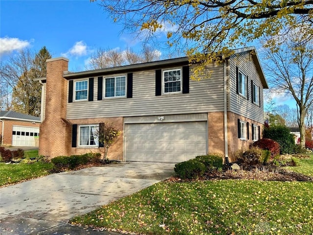 view of front facade with a garage and a front lawn