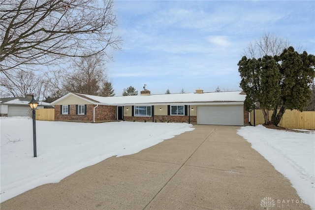 single story home featuring a garage