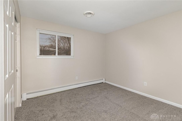 unfurnished room with carpet floors and a baseboard radiator