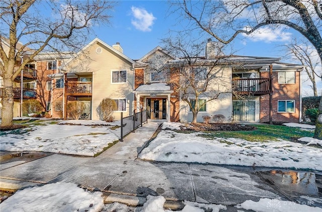 view of front of home with a balcony