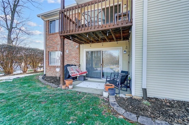 back of property with a yard and a patio area