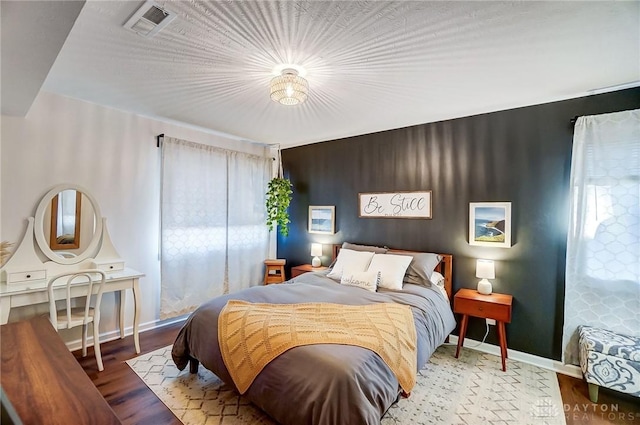 bedroom featuring hardwood / wood-style flooring