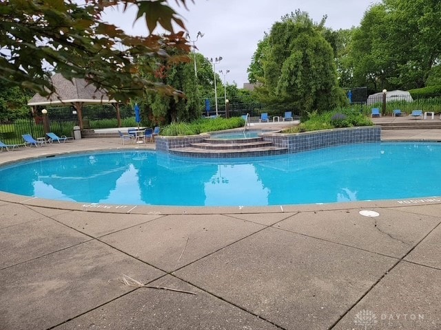 view of pool featuring a community hot tub