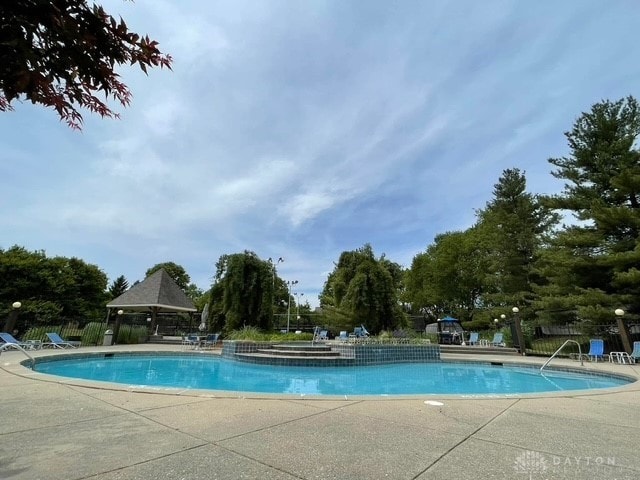 view of swimming pool with a gazebo