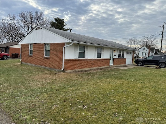 view of home's exterior featuring a garage and a lawn