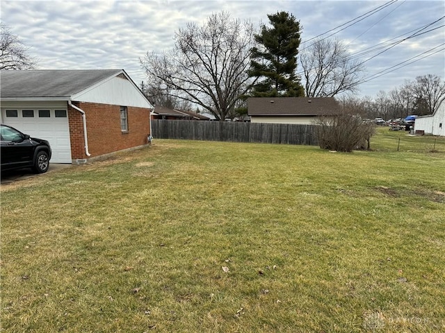 view of yard with a garage