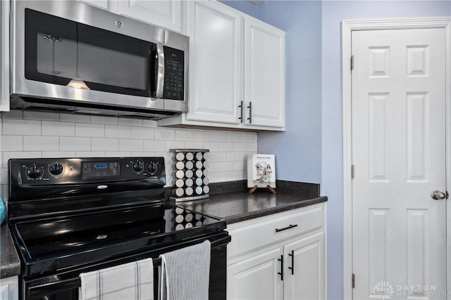 kitchen featuring white cabinetry, black electric range, and tasteful backsplash